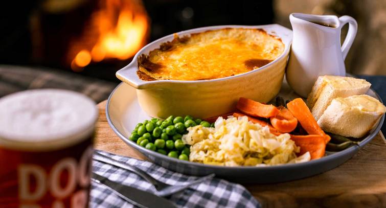 Home cooked cottage pie in front of a fire place