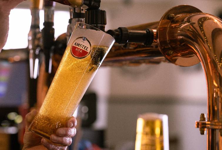 Pint of Amstel being poured 